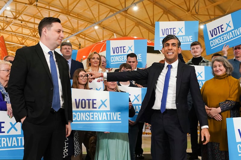 Conservative party candidate Ben Houchen, left, one incumbent survival, with Britain's Prime Minister Rishi Sunak, following his re-election as Tees Valley Mayor in Teesside, England, on May 3. PA via AP