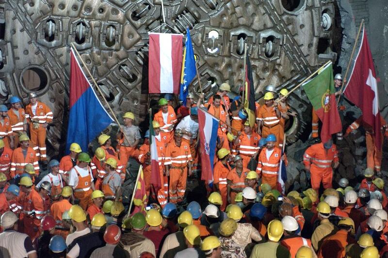 Miners celebrate a breakthrough in the NEAT Gotthard base tunnel in Faido, Switzerland, in September, 2006. Karl Mathis / Keystone via AP
