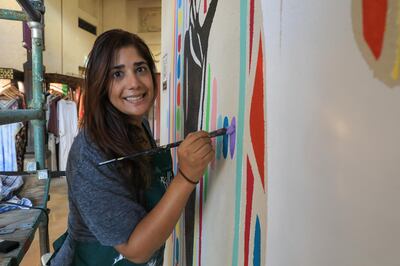 Amrita Sethi with her mural ''Halla Walla'