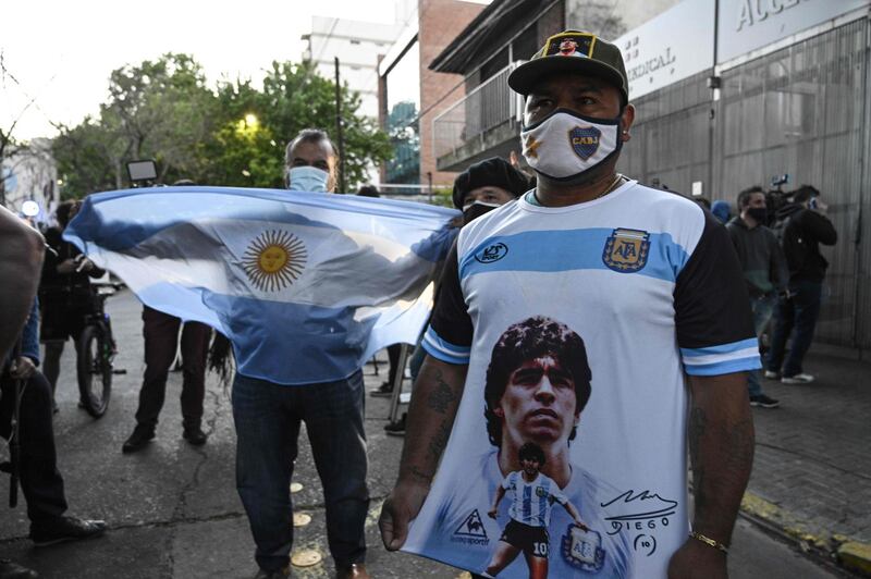 Supporters of Diego Maradona gather outside the hospital where underwent brain surgery for a blood clot. AFP