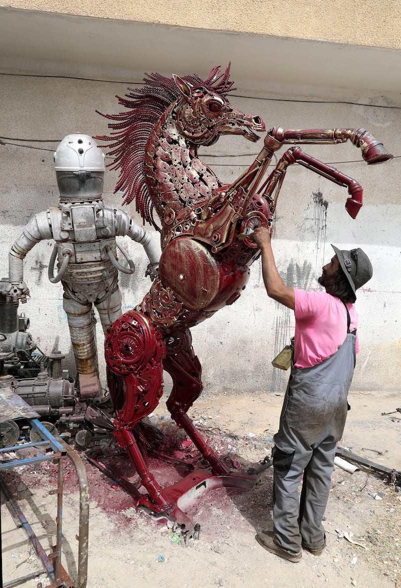 Tunisian artist Mohamed Al Sharaiti, 53, manufactures human and animal-shaped sculptures from car spare parts at his workshop in Nabeul, Tunisia. All photos: EPA