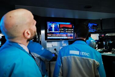 Traders work on the floor of the New York Stock Exchange. Over the past week, all the US indices have hit circuit breakers. AFP