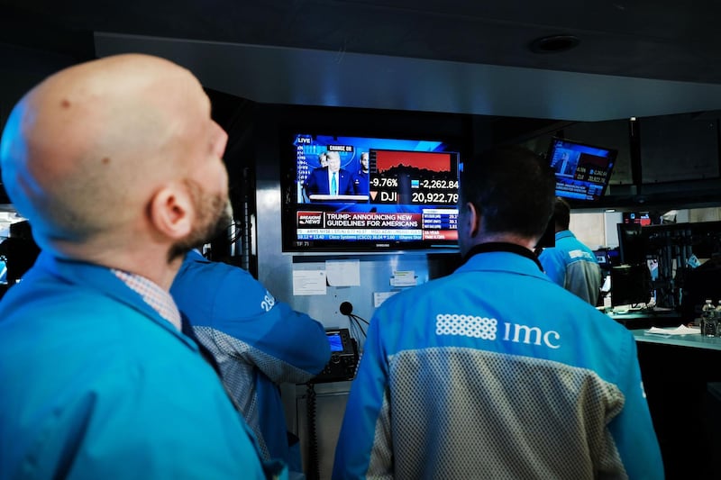 NEW YORK, NEW YORK - MARCH 16: Traders work on the floor of the New York Stock Exchange (NYSE) on March 16, 2020 in New York City. Stocks again fell sharply on Wall Street despite a drop in interest rates as the nation grapples with the spreading coronavirus outbreak.   Spencer Platt/Getty Images/AFP
== FOR NEWSPAPERS, INTERNET, TELCOS & TELEVISION USE ONLY ==
