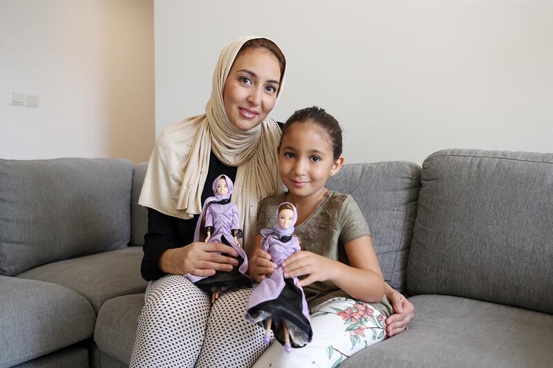 DUBAI , UNITED ARAB EMIRATES , JULY 19  – 2017 :- Left to Right -  Samira Amarir and her daughter Jenna ( 7 years old ) with the Jenna the Quran teacher doll designed by Samira Amarir at her home in Jumeirah Beach Residence in Dubai. ( Pawan Singh / The National ) Story by Anna Zacharia