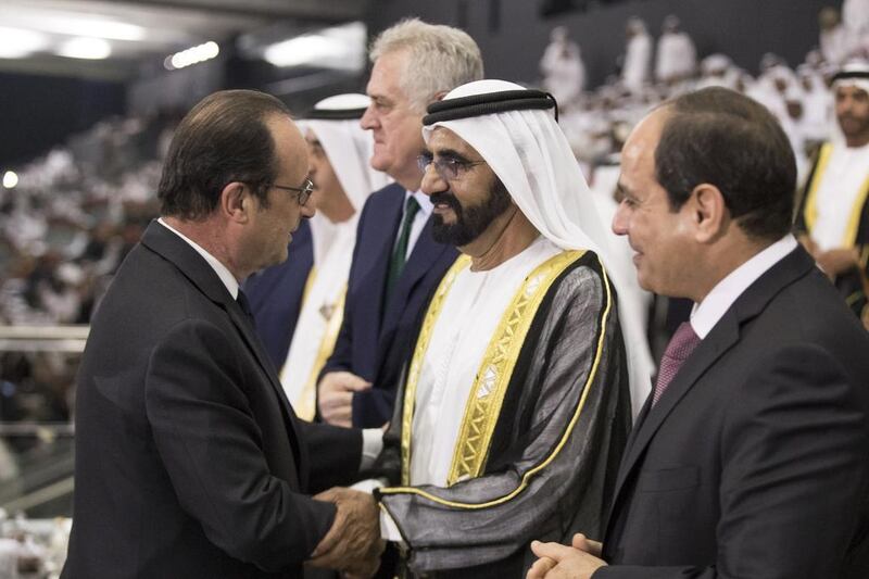 Francois Hollande greets Sheikh Mohammed bin Rashid during the 45th UAE National Day celebrations at Adnec. Seen with Abdel Fattah El Sisi. Ryan Carter / Crown Prince Court — Abu Dhabi