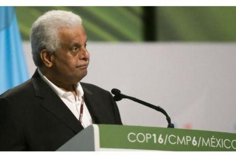Qatar's Abdullah bin Hamad al Attiyah says the answer to climate change must be scientifically and economically sound. Omar Torres / AFP