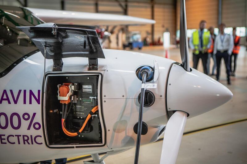 The battery hatch sits open as an electrical charging plug sits connected to an Avinor AS Alpha Electro G2 electric two-seater plane ahead of its inaugural flight at Oslo airport, in Gardermoen, near Oslo, Norway, on Monday, June 18, 2018. Home to some of the busiest flight routes in Europe, whisking passengers across a rugged and mountainous landscape, Norway’s aviation industry now readies to go electric. Photographer: Odin Jaeger/Bloomberg