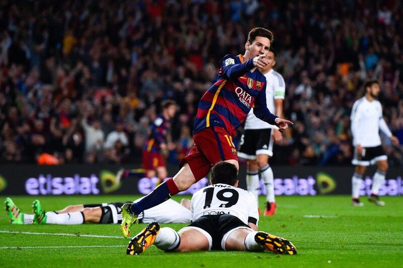 Lionel Messi of FC Barcelona celebrates after scoring his team’s first goal during the La Liga match between FC Barcelona and Valencia CF at Camp Nou on April 17, 2016 in Barcelona, Spain. (Photo by David Ramos/Getty Images)