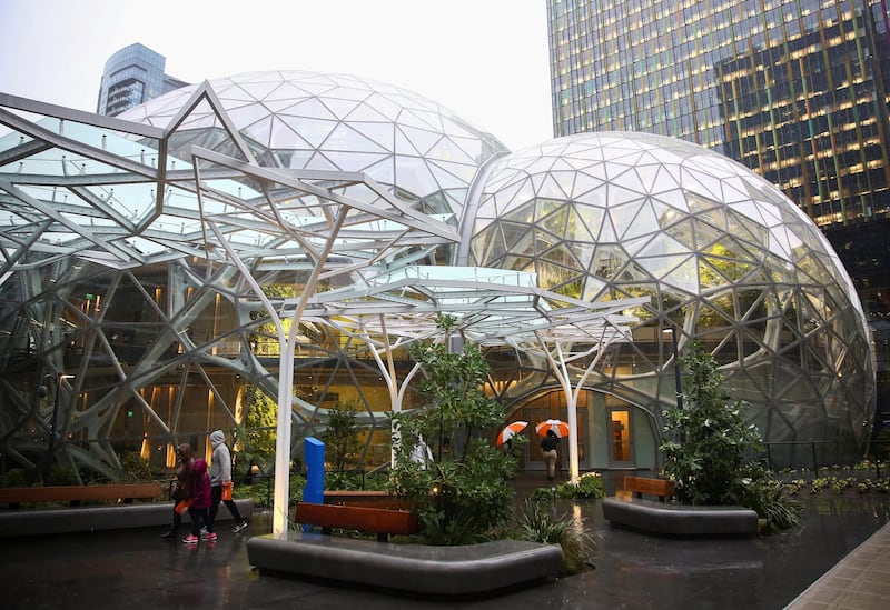 People walk by the main entrance of the Amazon Spheres at Amazon's Seattle headquarters in Seattle, Washington, U.S., January 29, 2018.    REUTERS/Lindsey Wasson
