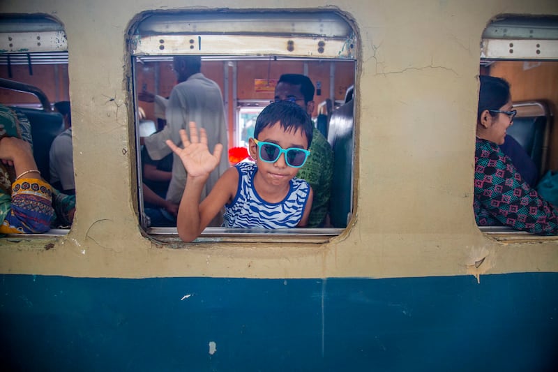 The sunglasses are on as the packed train leaves Dhaka. EPA 