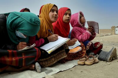 Afghan children attend an open-air school in Kabul last month. The Taliban government, which seized power more than a year and a half ago following the withdrawal of US troops, has banned girls from attending secondary schools and universities. EPA