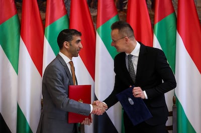 UAE Minister of State for Foreign Trade Dr Thani Al Zeyoudi, left, and Hungarian Minister of Foreign Affairs and Trade Peter Szijjarto during their meeting in Budapest on March 13. AP