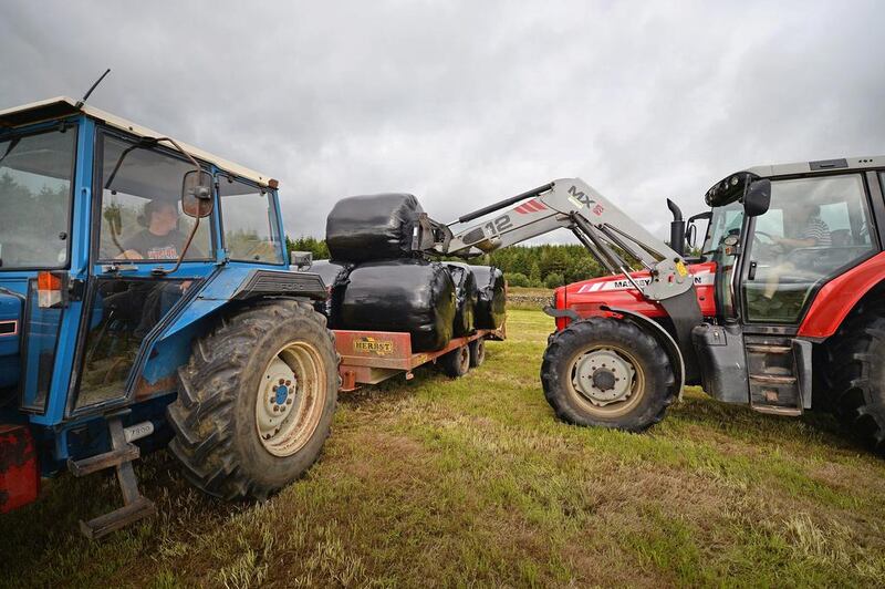 Carol McKenna brings in silage bails on Gass Farm in Kirkcowan, Scotland. New figures show a surge in the number of women in agriculture over the past decade compared to a sharp drop in the number of male farmers. Jeff Mitchell / Getty Images