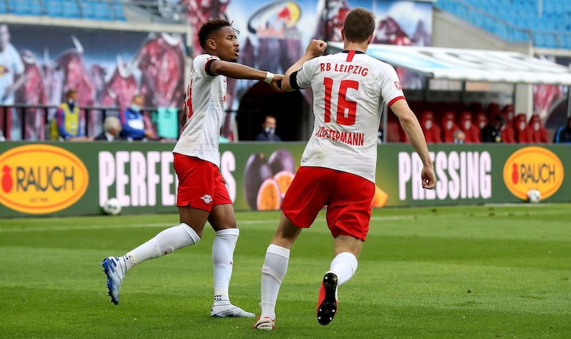 Leipzig defender Lukas Klostermann, right, celebrates after his goal. AFP