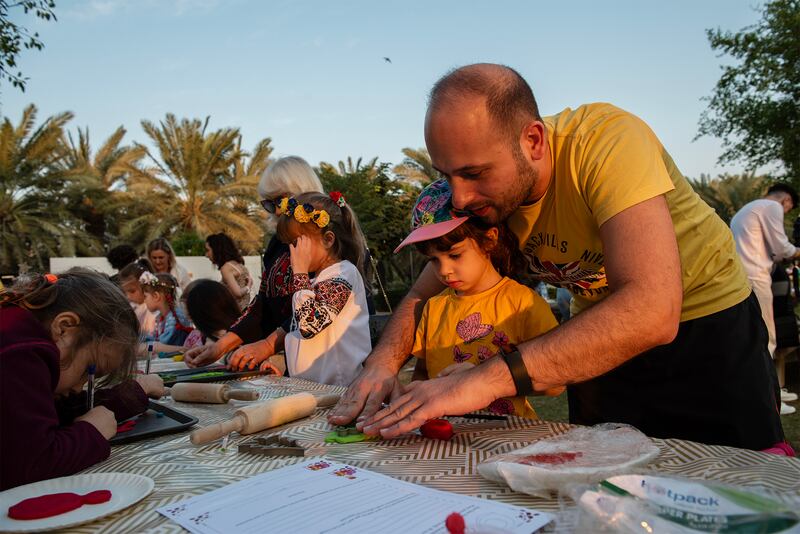 Moussa Khalil with his daughter Ivana during a workshop.
