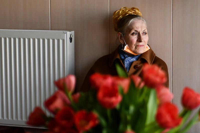 A woman who fled Ukraine waits in the hostel in Budapest. Nearly 300 Ukrainian refugees, mostly women and children, are being housed in the hostel near the centre of Budapest.  AP