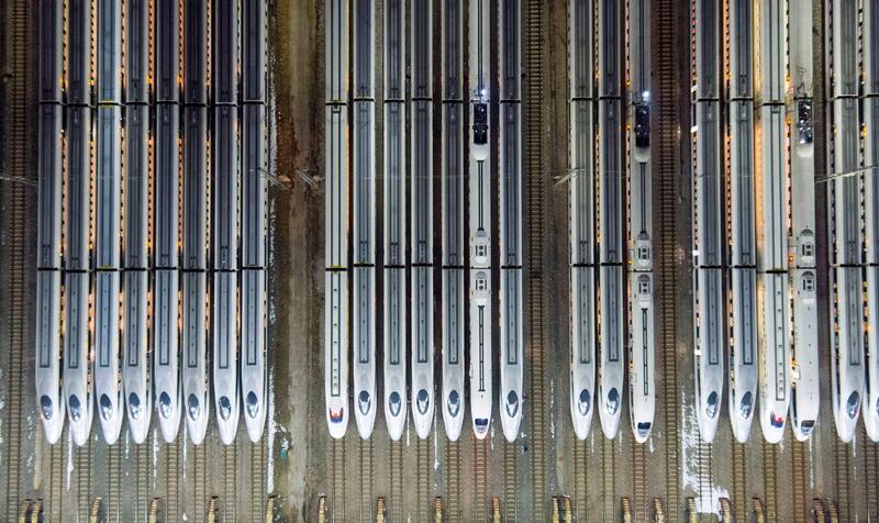 This aerial photograph shows high speed trains at a maintenance centre in Wuhan, in China's central Hubei province on February 1, 2018, the start of China's official peak travel period because of the Lunar New Year. Authorities expect more than 390 million train trips to take place between February 1 and March 12. AFP