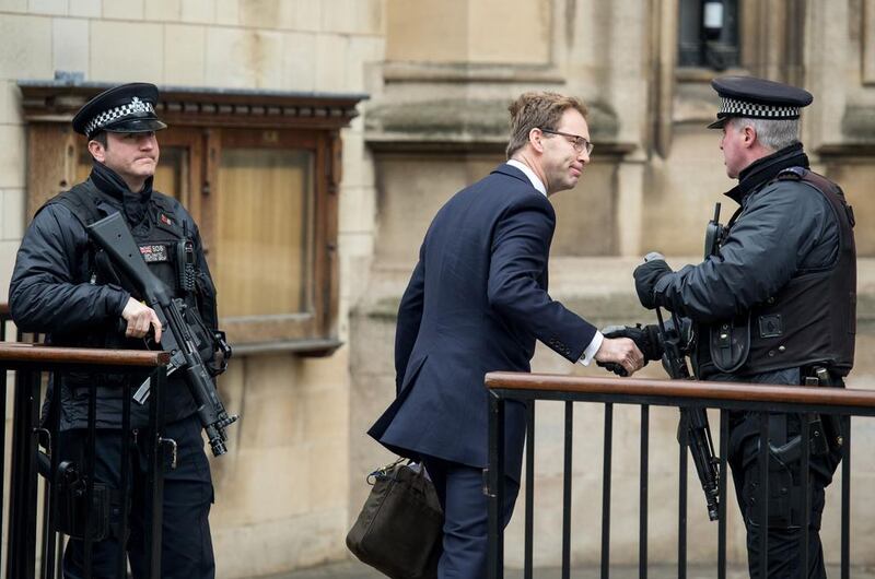 British Conservative Party politician Tobias Ellwood, left, arrives at the Houses of Parliament after the London attack. Chris J Ratcliffe / AFP. 