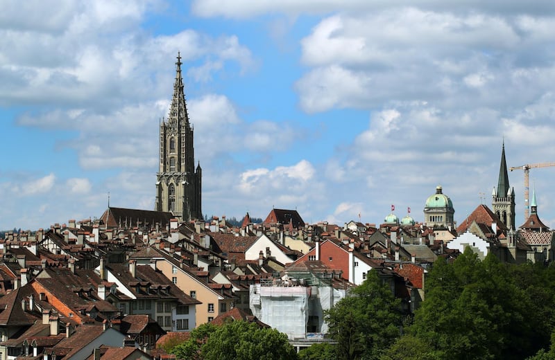 The Swiss Federal Palace and the Bern Minster (Berner Muenster) are pictured in the UNESCO listed old town in Bern, Switzerland May 15, 2019.  REUTERS/Denis Balibouse