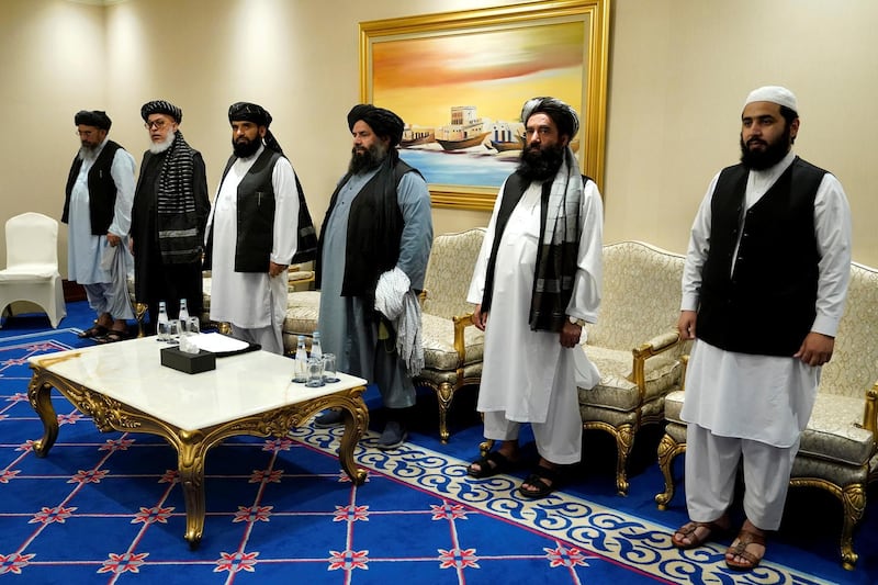 Members of the Taliban's peace negotiation team attend a meeting with U.S. Secretary of State Mike Pompeo, amid talks between the Taliban and the Afghan government, in Doha, Qatar November 21, 2020. Patrick Semansky/Pool via REUTERS