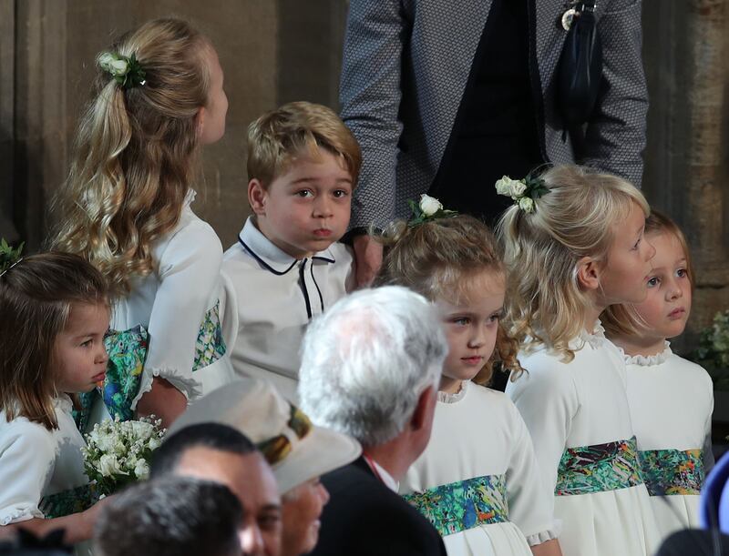 The bridesmaids and page boys, including Prince George, arrive ahead of the wedding of Princess Eugenie of York and Mr Jack Brooksbank at St. George's Chapel, Windsor, in October 2018. Getty Images