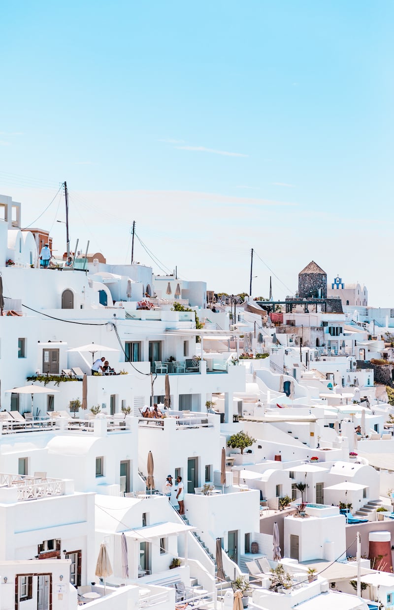 White exteriors reflect the sunlight, meaning the building does not absorb as much of the heat. Photo: Unsplash