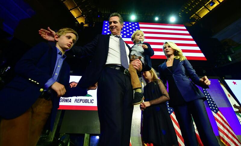 California's Democratic gubernatorial candidate Gavin Newsom and his family arrives on stage at his election night watch party in Los Angeles, California. AFP