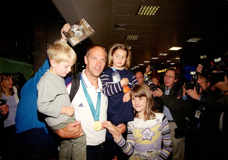Rower Steve Redgrave at Heathrow with daughters Sophie and Natalie and son Zak after returning from the Sydney 2000 Olympic Games with his gold medal