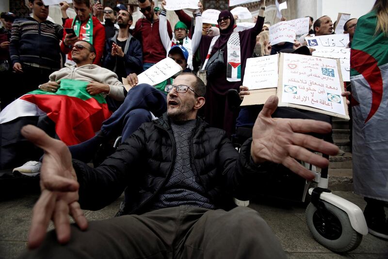 People with special needs, accompanied by their families, take part in a protest in Algiers, Algeria. Reuters