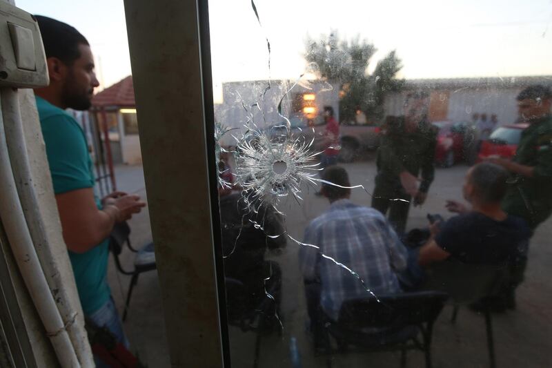 A view of a bullet hole seen in a window inside the headquarters of the Palestinian Preventive Security in Nablus on the West Bank. EPA