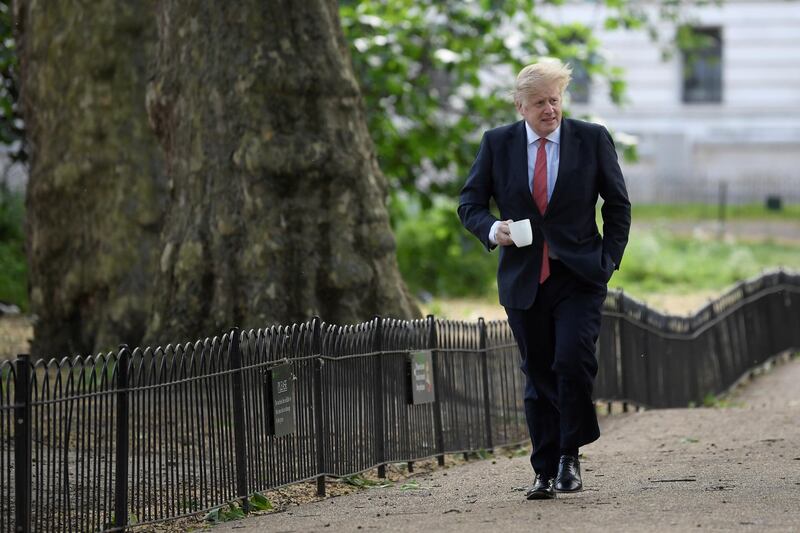 Boris Johnson goes for a walk in Central London, May 11. Toby Melville/ Reuters