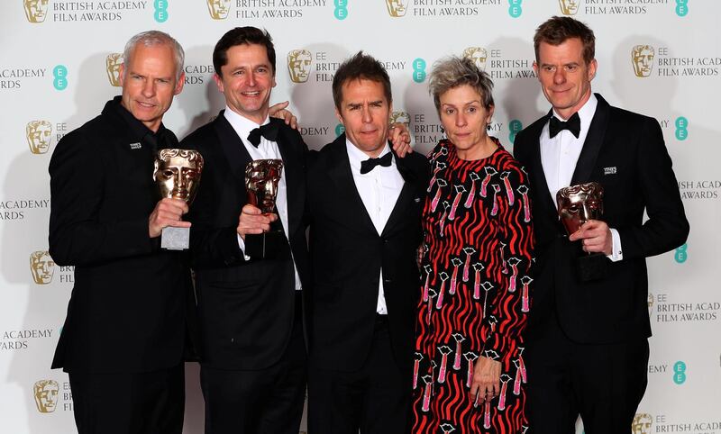 Martin McDonagh, Peter Czernin, Sam Rockwell and Graham Broadbent, pose with Frances McDormand, as they hold their trophies for Best Film for 'Three Billboards Outside Ebbing Missouri' at the British Academy of Film and Television Awards (BAFTA) at the Royal Albert Hall in London, Britain February 18, 2018. REUTERS/Hannah McKay