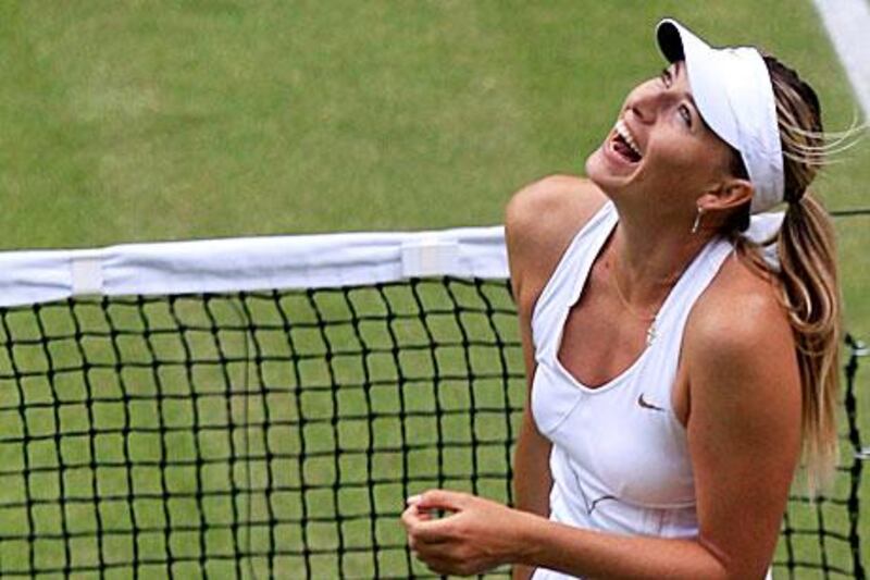 Maria Sharapova celebrates after defeating Sabine Lisicki after their semi-final match.