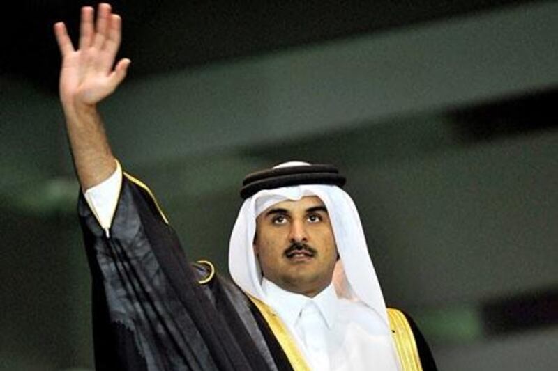 epa02130461 Qatar's Crown Prince Sheikh Tamim bin Hamad al-Thani waves as he arrives at Al-Sadd Stadium for the final match of the Crown Prince Cup soccer tournament between Qatari teams Al-Arabi and Al-Gharafa in Doha, Qatar, 24 April 2010.  EPA/STRINGER *** Local Caption ***  02130461.jpg