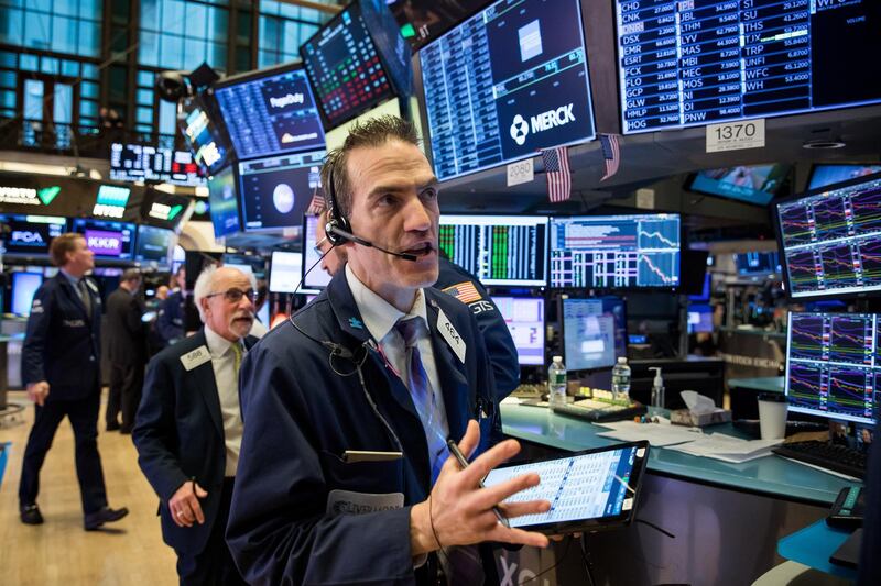 Traders work on the floor of the New York Stock Exchange (NYSE) in New York, U.S., on Wednesday, Feb. 26, 2020. U.S. equities swung between gains and losses as investors digested fresh evidence of the widening coronavirus outbreak. Photographer: Michael Nagle/Bloomberg