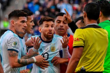 Argentina's Lionel Messi remonstrates with the referee Mario Diaz de Vivar after he and Chile's Gary Medel were sent off during their Copa America third-place match at the Corinthians Arena in Sao Paulo, Brazil. AFP