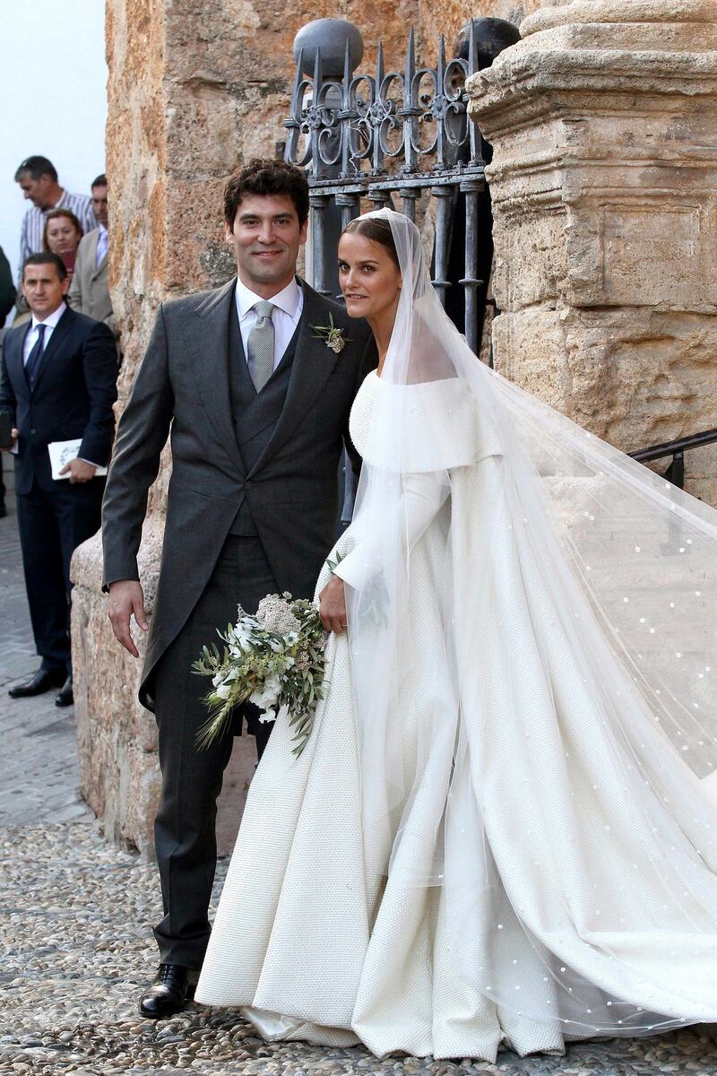 epa05334392 Newlyweds Lady Charlotte Wellesley (R) and Colombian billionaire Alejandro Santo Domingo smile after their wedding ceremony at the Chuch of the Incarnation in Illora, Andalusia, southern Spain, 28 May 2016. The Wellesley family owns a country house in the town.  EPA/DANIEL PEREZ