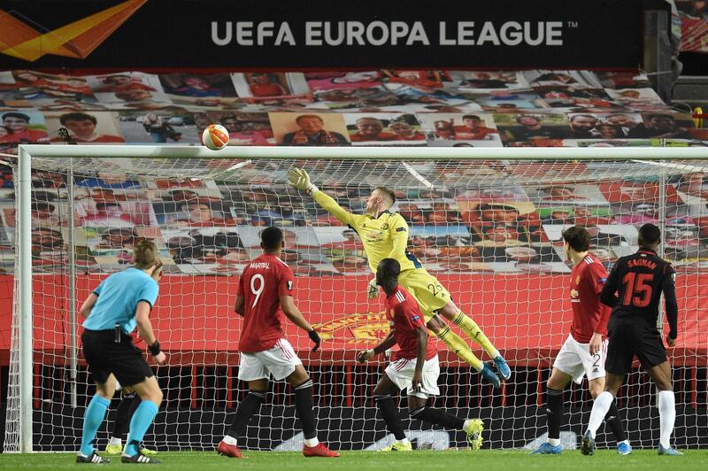 Real Sociedad's Modibo Sagnan watches his header hit the bar as Manchester United's goalkeeper Dean Henderson  dives during the Europa League round of 32, second leg. AFP