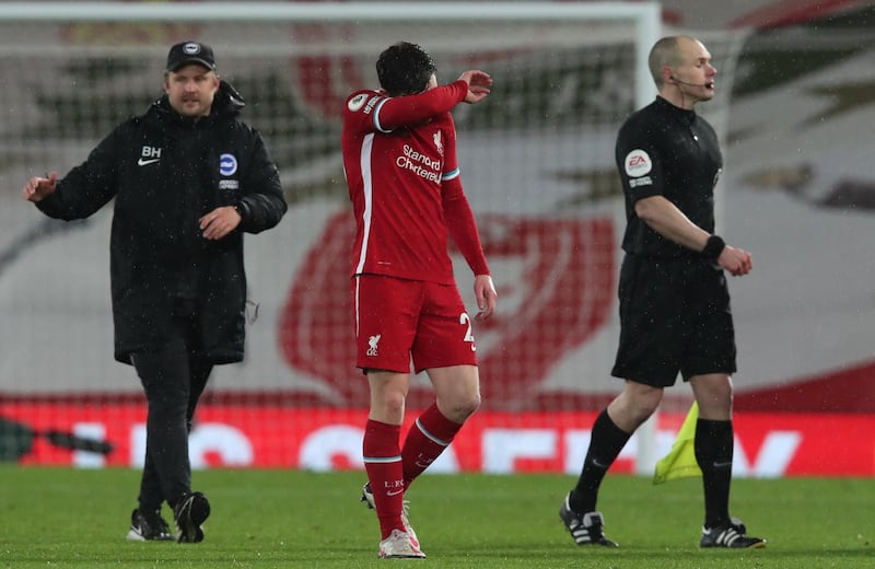 LIVERPOOL, ENGLAND - FEBRUARY 03: Andy Robertson of Liverpool looks dejected following the Premier League match between Liverpool and Brighton & Hove Albion at Anfield on February 03, 2021 in Liverpool, England. Sporting stadiums around the UK remain under strict restrictions due to the Coronavirus Pandemic as Government social distancing laws prohibit fans inside venues resulting in games being played behind closed doors. (Photo by Clive Brunskill/Getty Images)