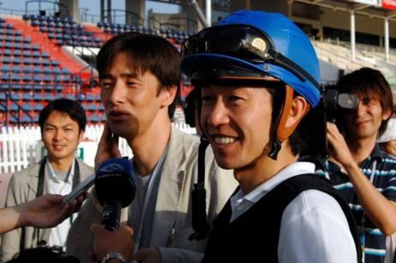 Japanese jockey Yutaka Take, who will be racing with horses Vodka and Bamboo Ere, speaks to the press during a training session ahead of the Dubai World Cup 2009 in the Nad Al-Sheba racecourse in the Gulf emirate on March 24, 2009. The Dubai World Cup is the richest horse race in the world and will be staged on March 28. AFP PHOTO/HAIDER SHAH *** Local Caption ***  Nic349576.jpg