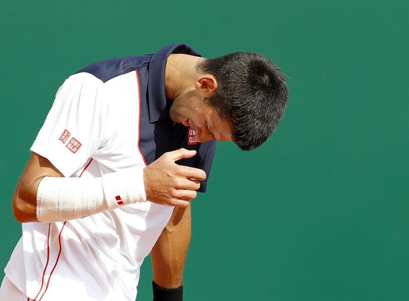 Novak Djokovic reacts during his semi-final match against Roger Federer at April's Monte Carlo Masters. Sebastien Nogier / EPA / April 19, 2014