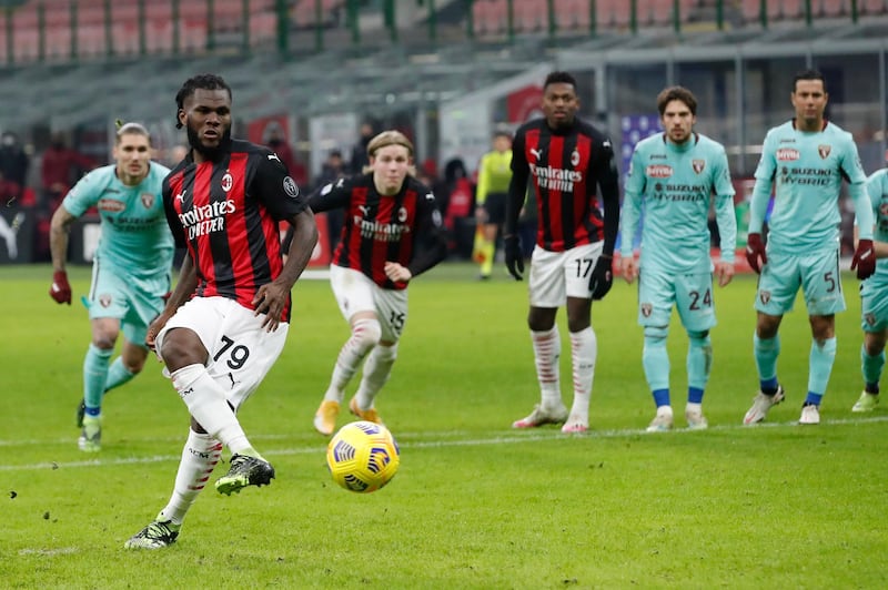 Milan's Franck Kessie, left,  scores from the penalty spot. AP