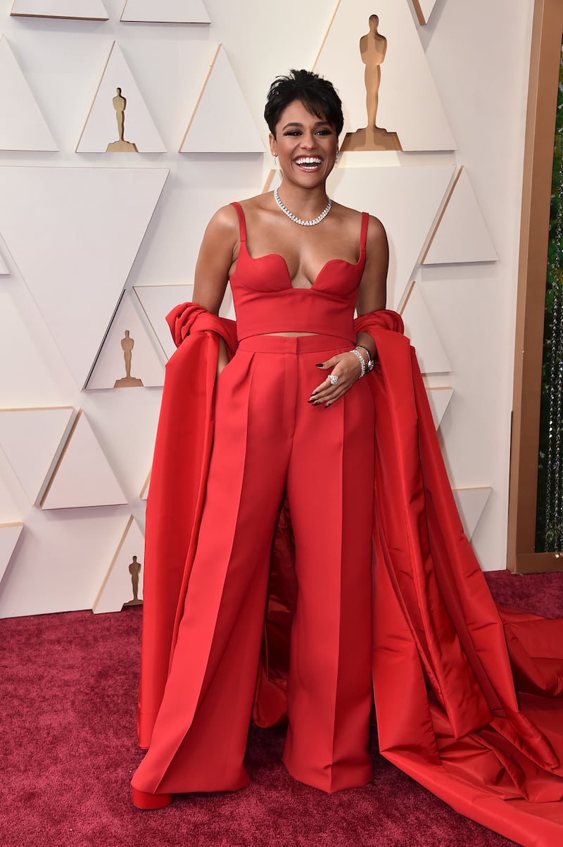 Ariana DeBose, wearing a caped red Valentino two-piece. AP