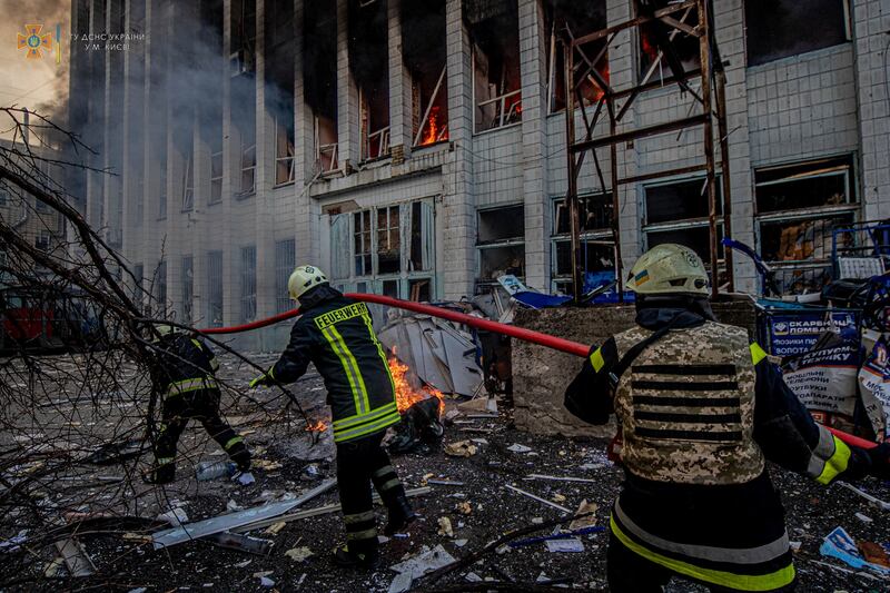 Rescue workers at an industrial building damaged by an air strike in Kyiv, Ukraine. Reuters