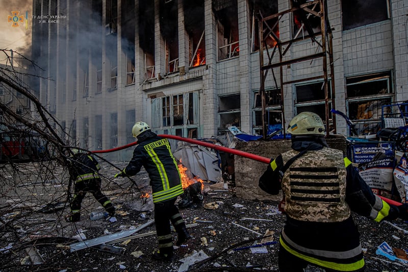 Rescue workers at an industrial building damaged by an air strike in Kyiv, Ukraine. Reuters