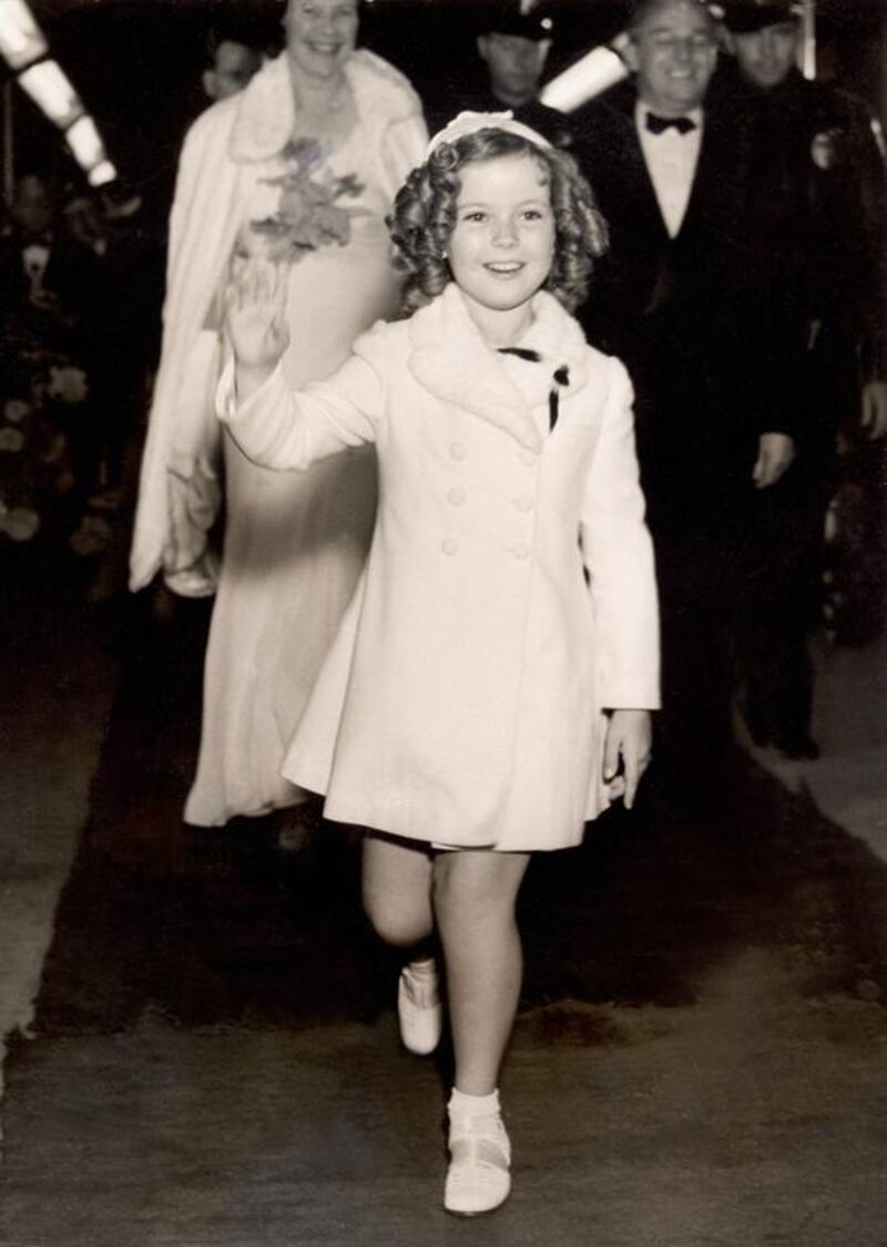 Shirley Temple arriving at her first main premiere for the film Wee Willie Winkie in Hollywood. AFP