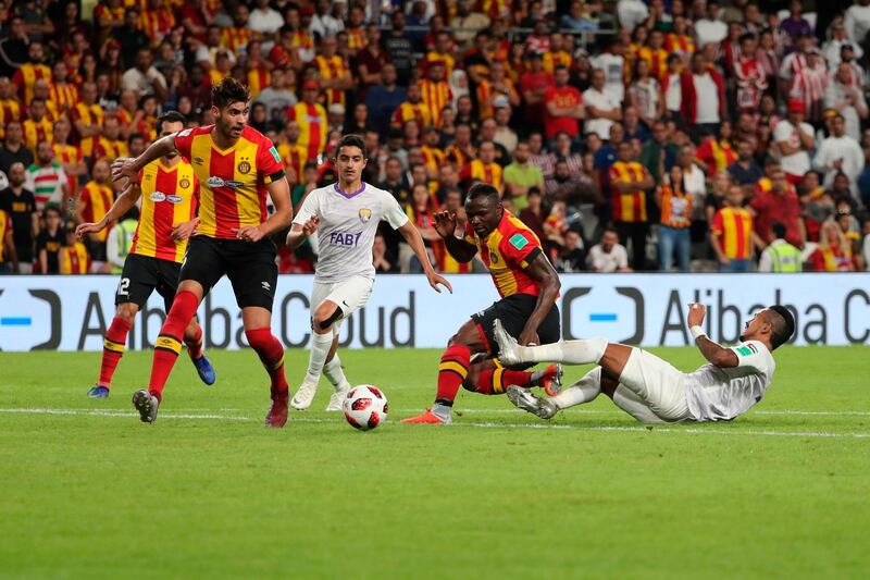 Al-Ain's midfielder Hussein el-Shahat (1st-R) fights for the ball with ES Tunis' midfielder Franck Kom (2nd-R) during the second round match of the FIFA Club World Cup 2018 football tournament between Tunisia's Esperance Tunis and Kashima Antlers and Abu Dhabi's al Ain at the Hazza Bin Zayed Stadium in Abu Dhabi, the capital of the United Arab Emirates, on December 15, 2018.  / AFP / Karim Sahib
