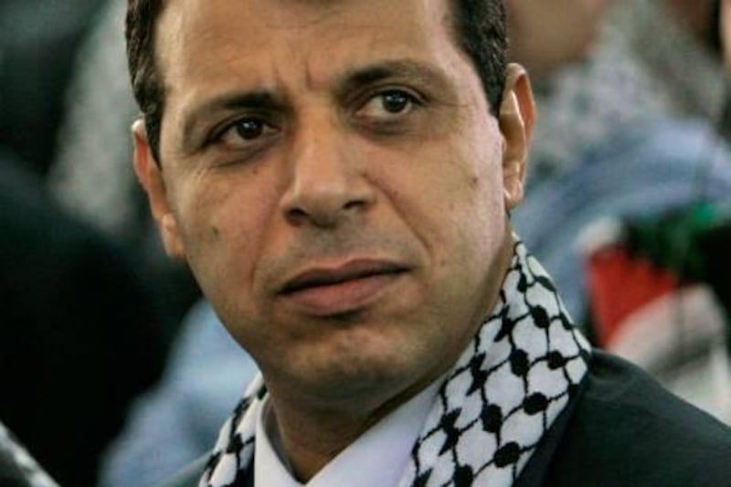 Palestinian Fatah leader Mohammed Dahlan listens to a speech during the Fatah conference in the West Bank town of Bethlehem, Tuesday, Aug. 4, 2009. The Palestinians' Fatah movement came together Tuesday for its first convention in 20 years, trying to rise from division and defeat with a pragmatic political program and new leaders, in what its supporters hope will be the final push toward Palestinian statehood. (AP Photo/Tara Todras-Whitehill)  *** Local Caption ***  JRL124_MIDEAST_ISRAEL_PALESTINIANS_FATAH_CONFERENCE.jpg