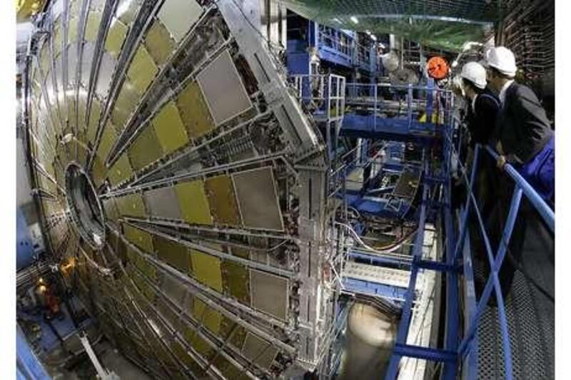 Spectators look at the Atlas detector designed to measure the broadest possible range of particles within the Large Hadron Collider at the Centre Europeen de Recherche Nucleaire (Cern) near Geneva, Switzerland.