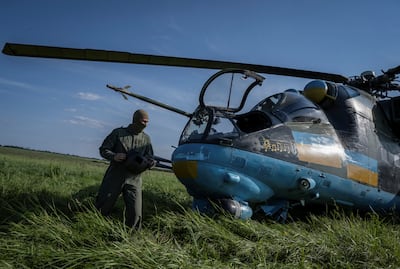 A Ukrainian pilot prepares to take off to carry out a mission in a Mi-24 attack helicopter. Reuters